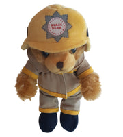 Plush toy bear wearing a yellow hat with a logo on a white background